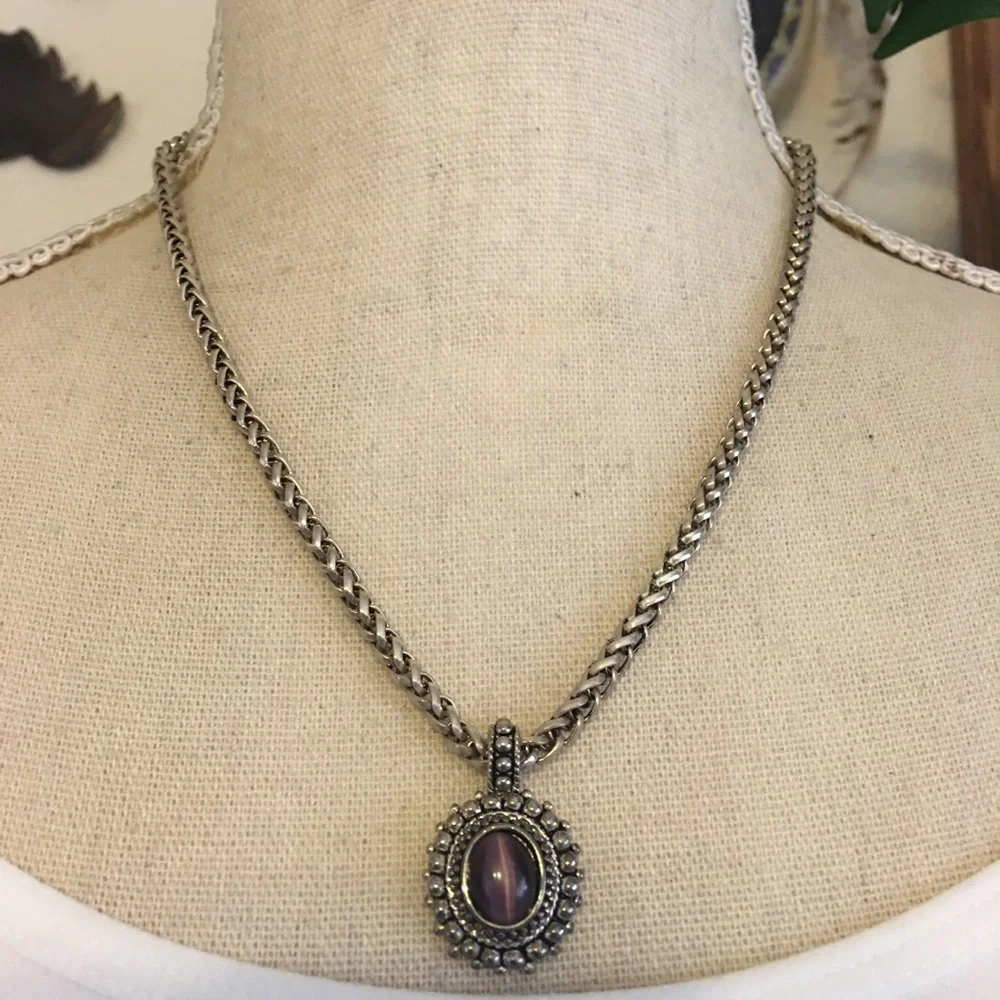 Accent purple cat eye pendant on braided chain